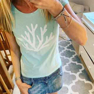 White coral on mint green tee